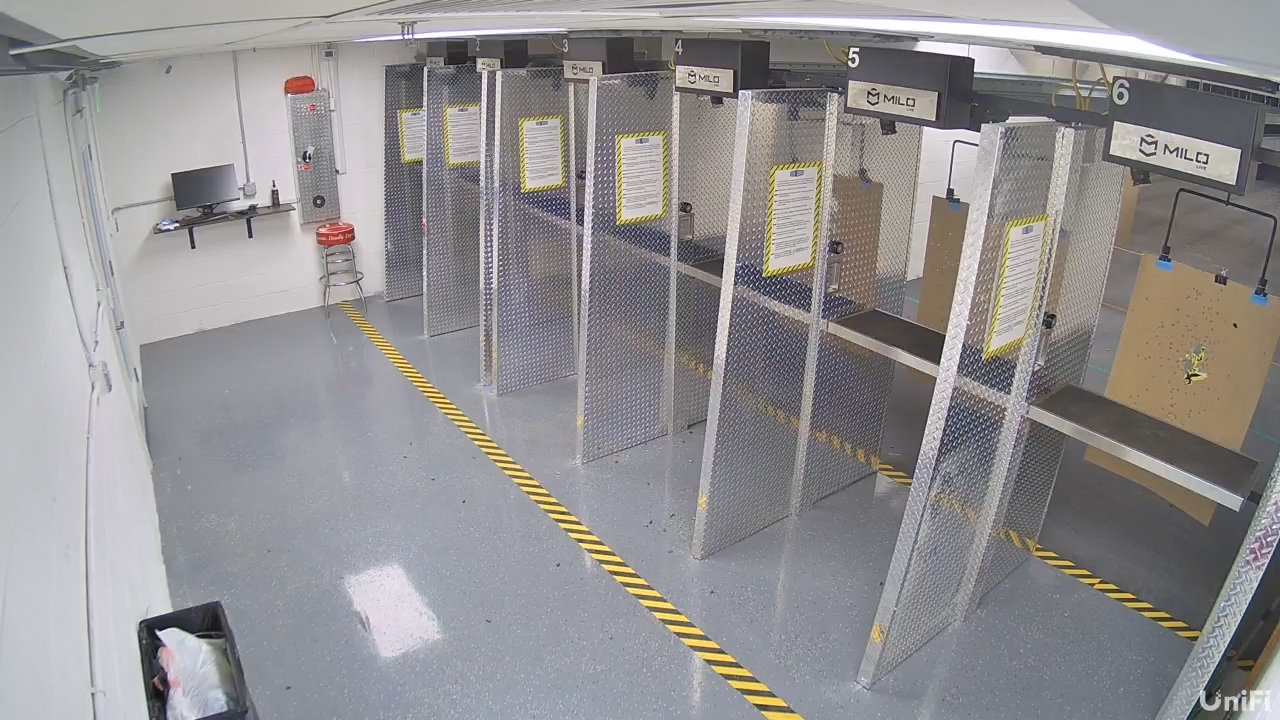 Our indoor lanes in Mesa: steel-lined booths and marked firing lines.